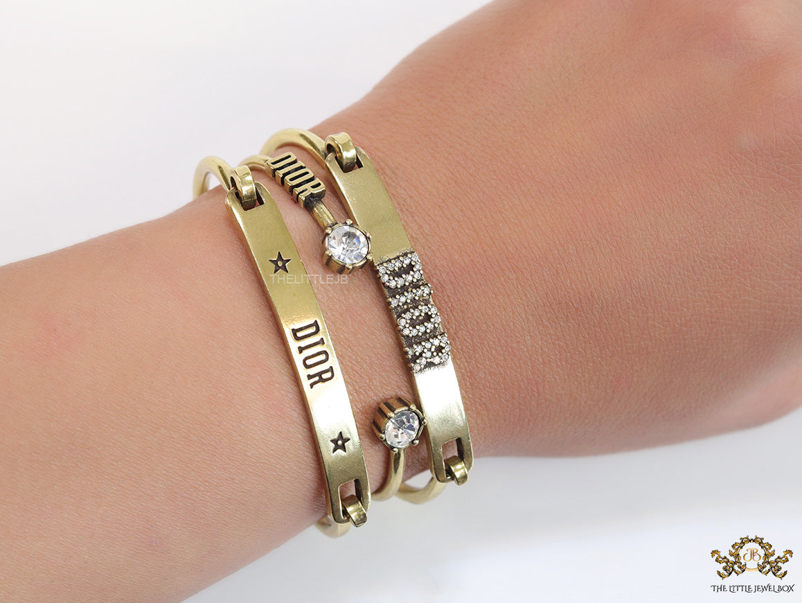 Multilayered golden alphabet bracelet with cz