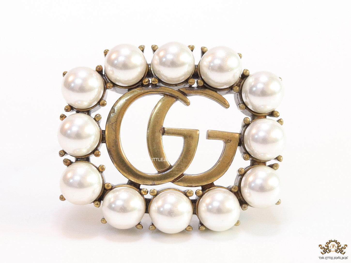 Pearls embraced alphabet brooch in gold finish