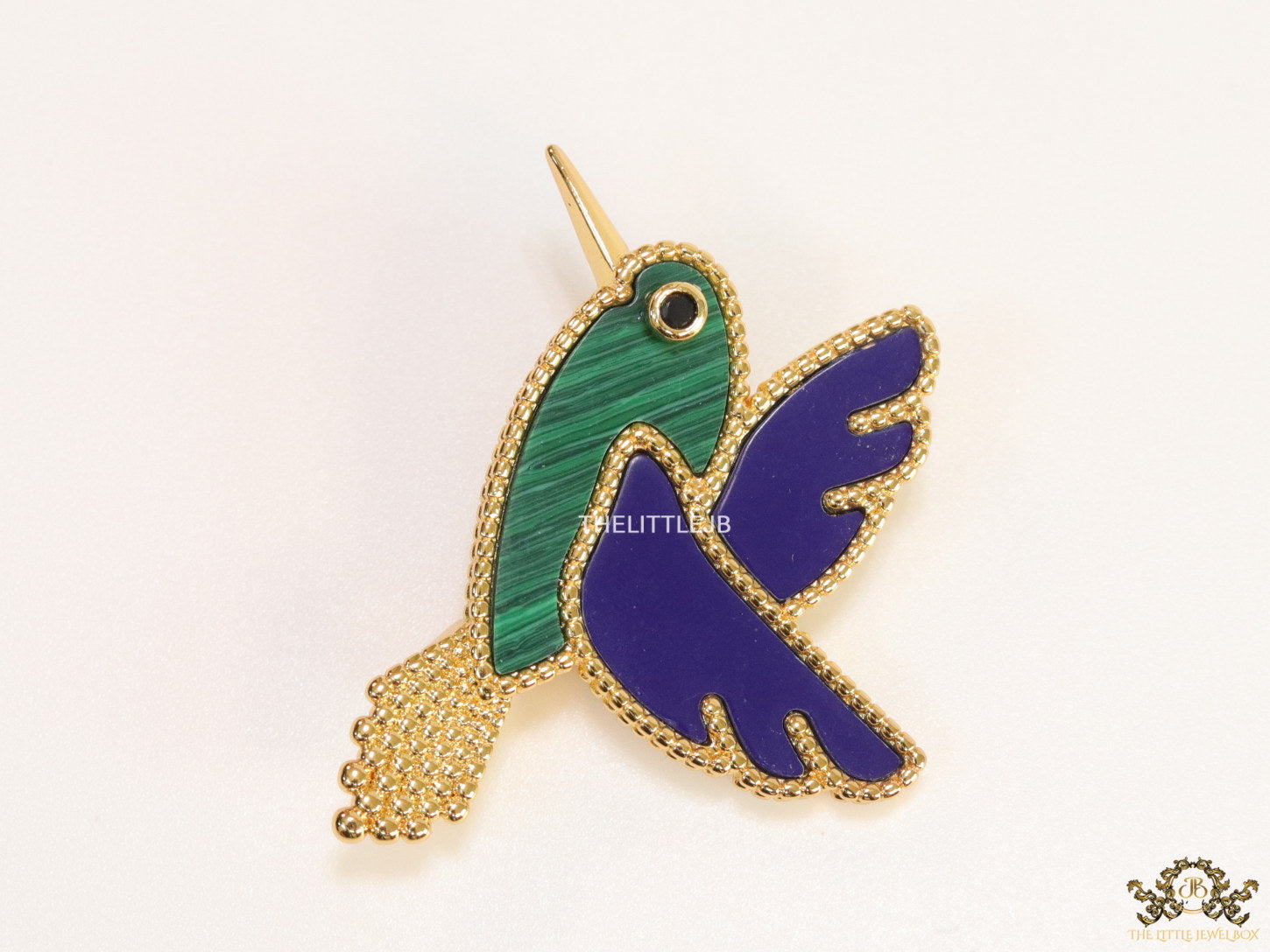 Gold plated multi-colour flying bird brooch