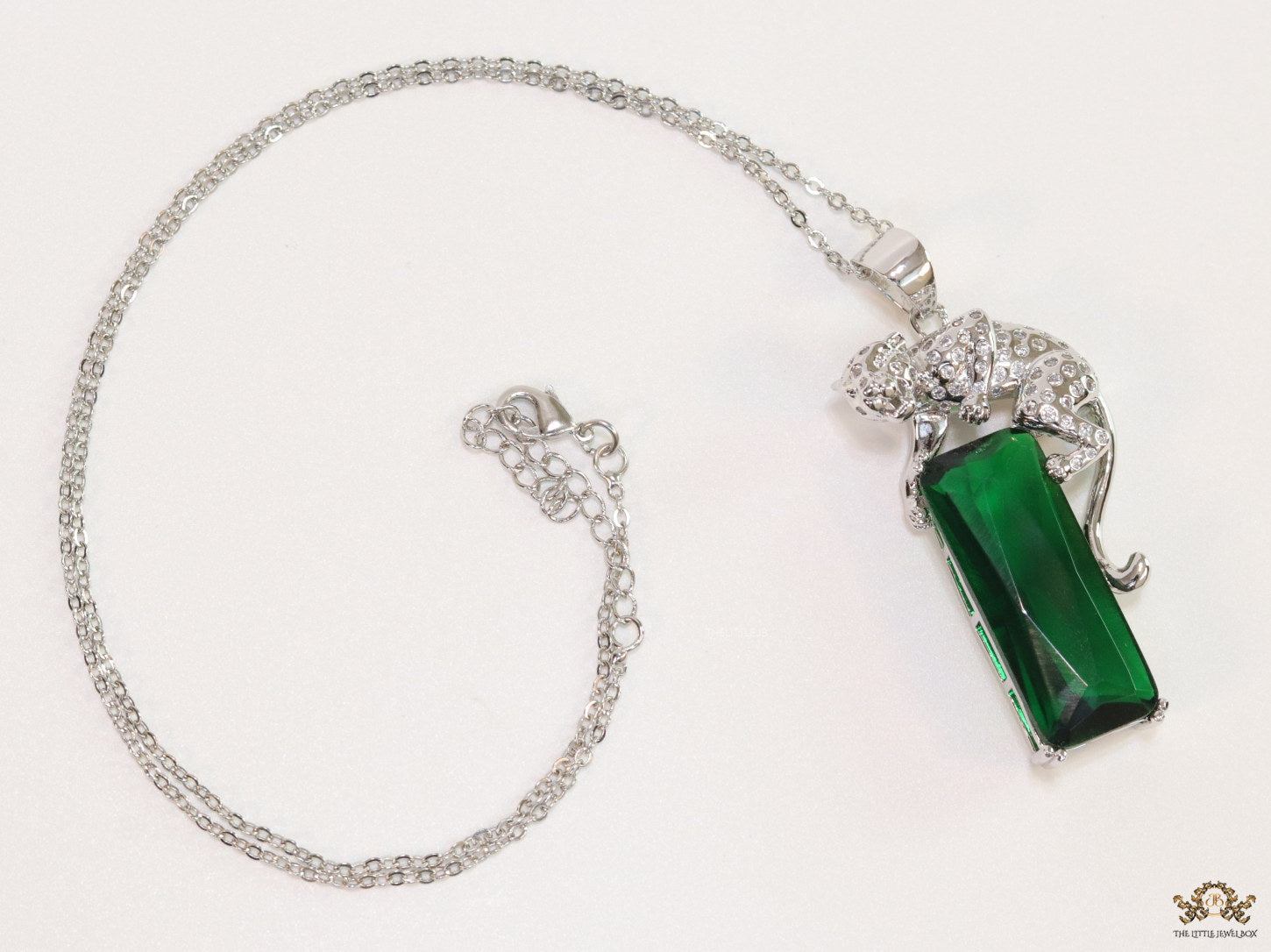 Platinum plated leopard on green stone pendant necklace with cz