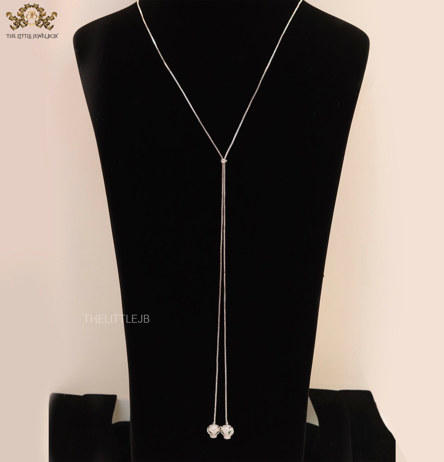 Platinum plated knot necklace with twin cz panther pendants