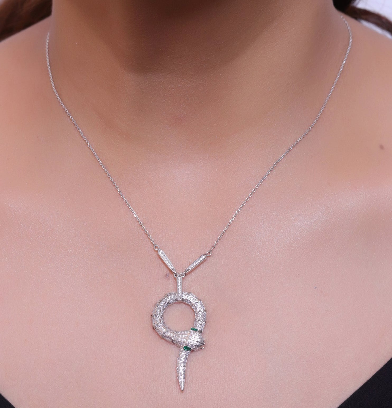 Sleek Platinum plated chain with Platinum plated cubic zirconia ancient serpentine symbol pendant