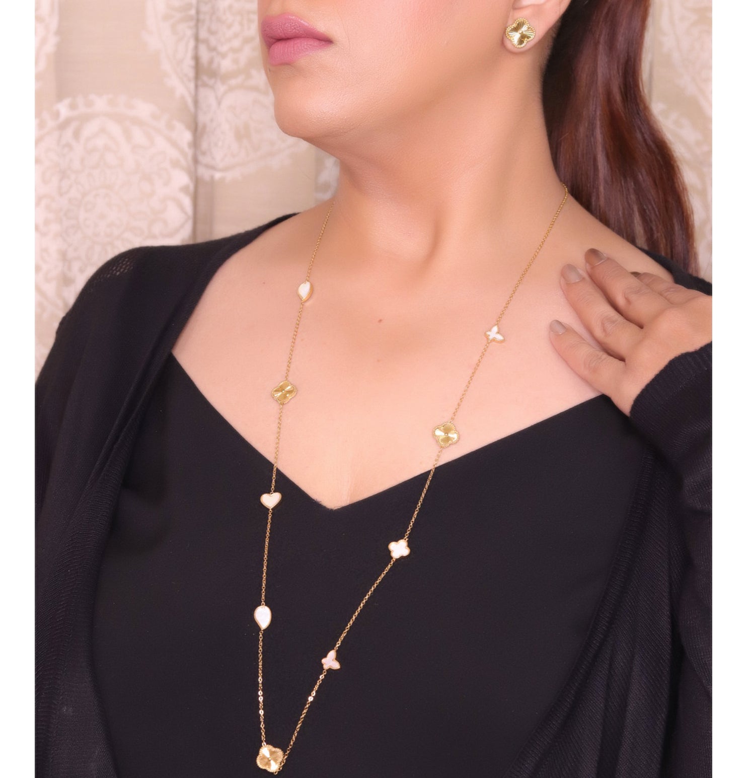 Pearl white clover heart and other shape charms on a sleek long gold plated chain with matching studs