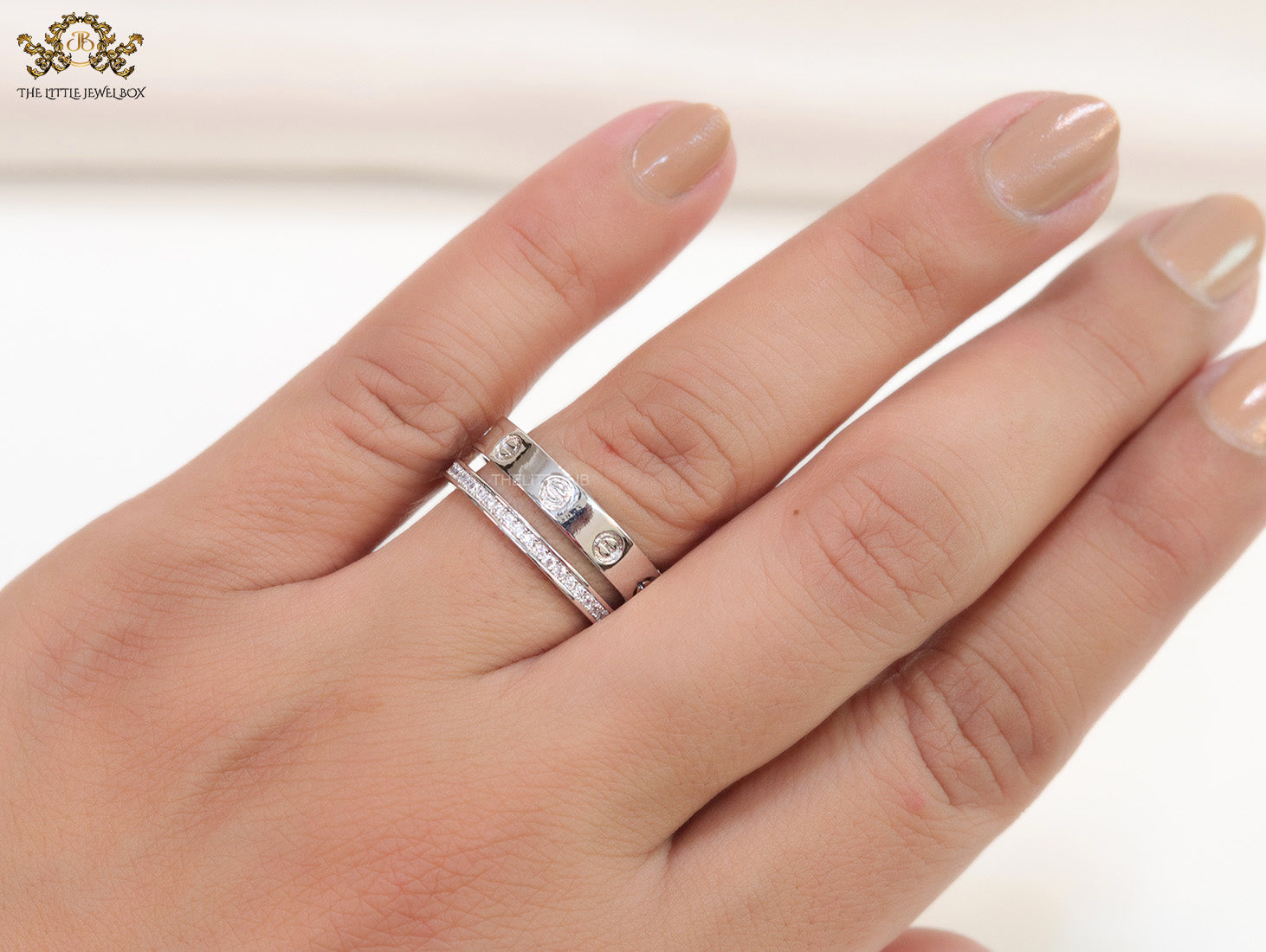 Double layered platinum plated finish open ring with screws and cz