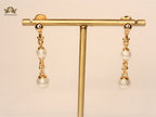Alphabet T & Co pearl and gold drop earring