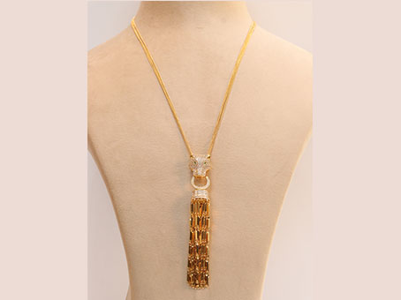 Gold panther face sleek tassel pendant