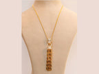 Gold panther face sleek tassel pendant