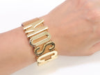 Alphabet M tan colour bracelet in gold finish