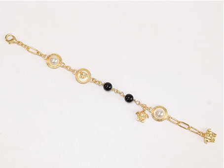 Gold medusa charms bracelet