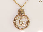 Gold plated lion face and double G initial necklace
