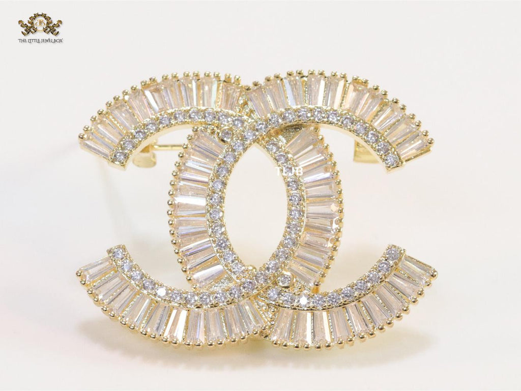 Gold finish Double C alphabet brooch with cz baguette