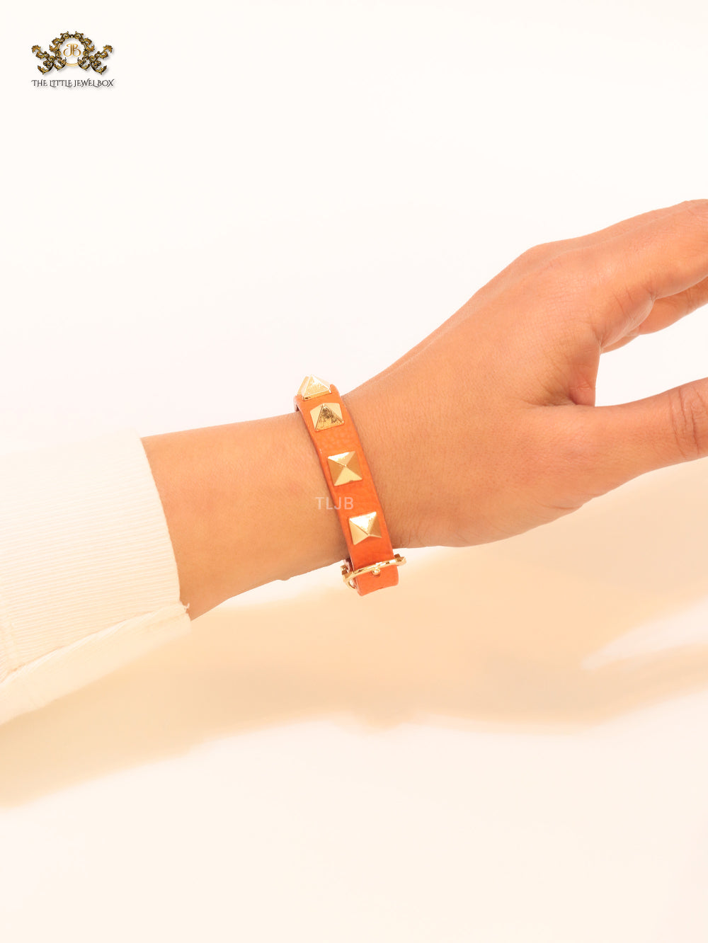 Alphabet V rockstud orange bracelet