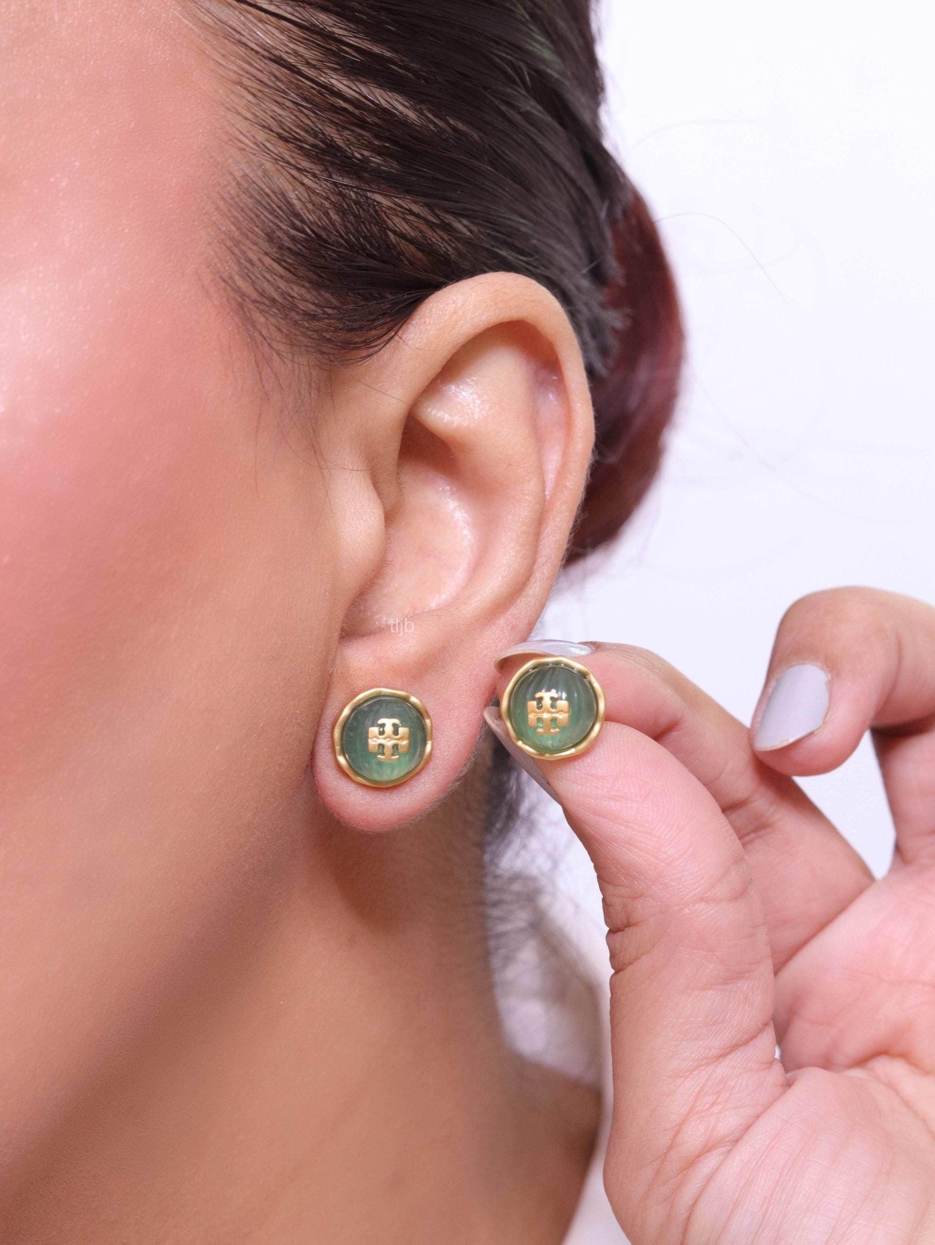 Alphabet T green studs in gold finish