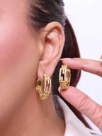 Double F hoops in gold finish with cz