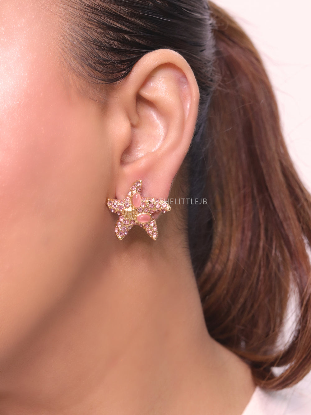 Pink gold star studs