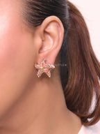 Pink gold star studs
