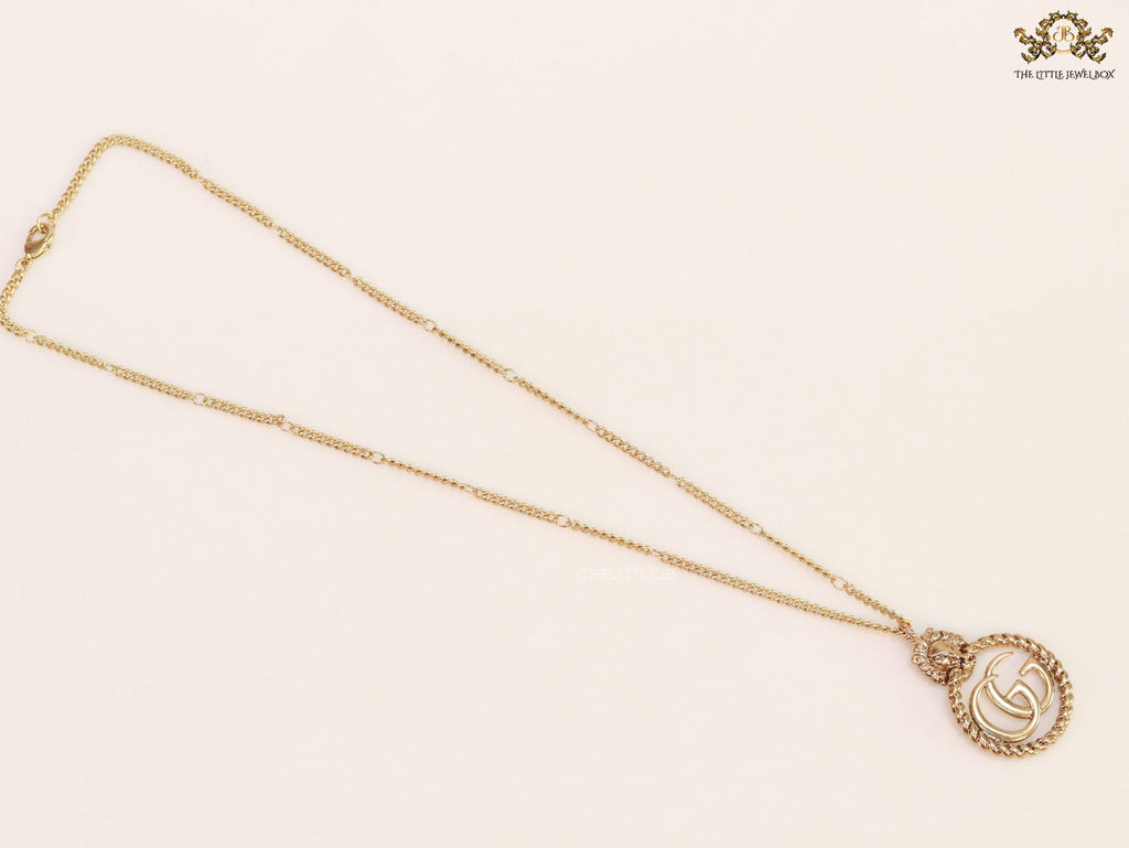 Gold plated lion face and double G initial necklace