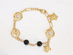 Gold medusa charms bracelet