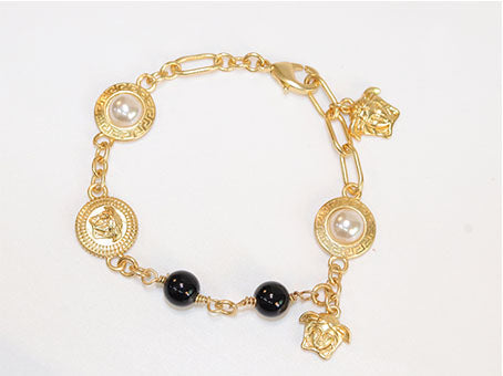 Gold medusa charms bracelet
