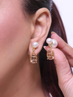 Alphabet C and D dangling baby pink stone pearl studs in rose gold finish