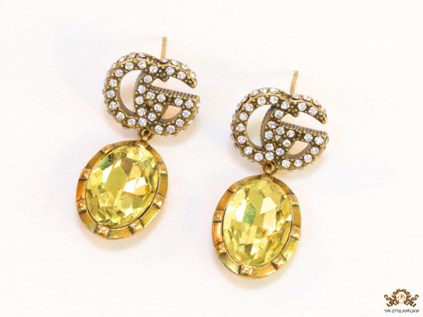 Rustic double G earings with oval yellow topaz drop