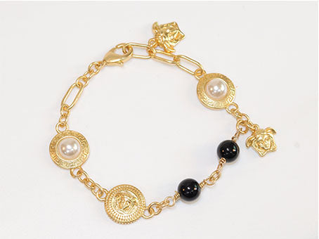 Gold medusa charms bracelet