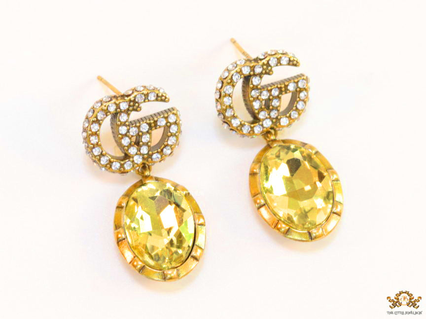 Rustic double G earings with oval yellow topaz drop
