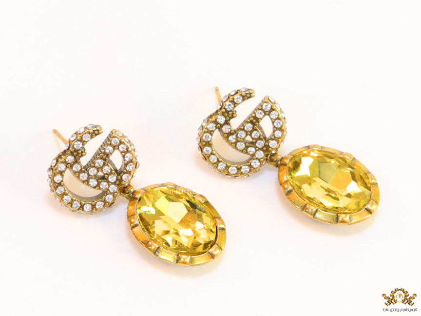 Rustic double G earings with oval yellow topaz drop
