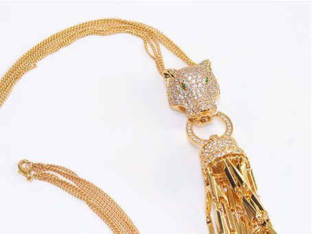 Gold panther face sleek tassel pendant