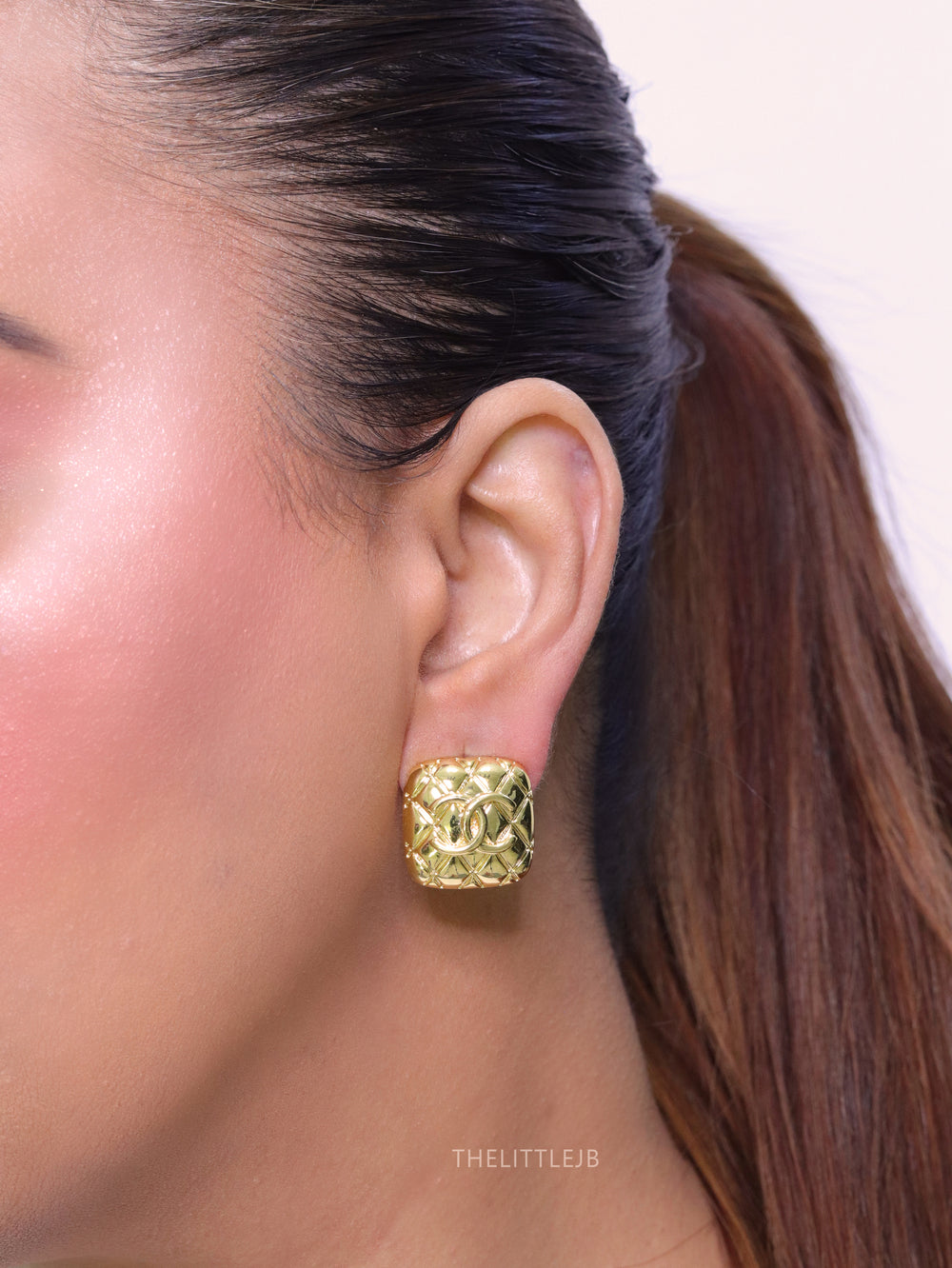 Embossed gold studs