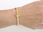 Alphabet T bracelet with half CZ in gold finish