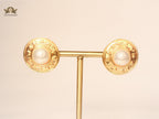 Double C pearl studs in Gold
