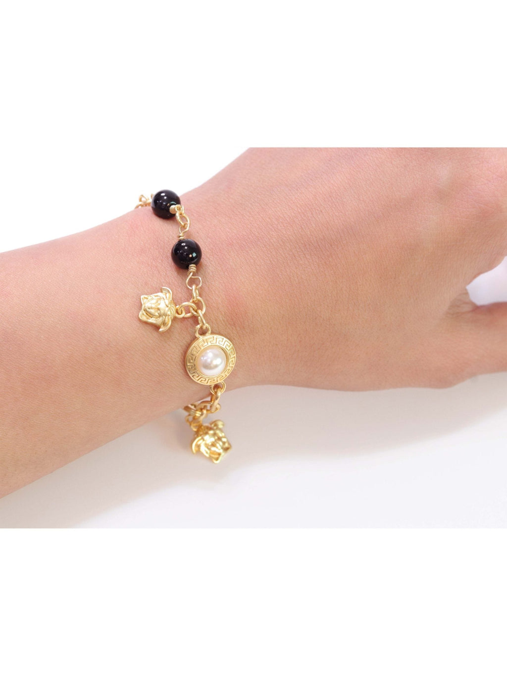 Gold medusa charms bracelet
