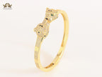 Panther heads gold and emerald bracelet