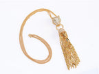 Gold panther face sleek tassel pendant