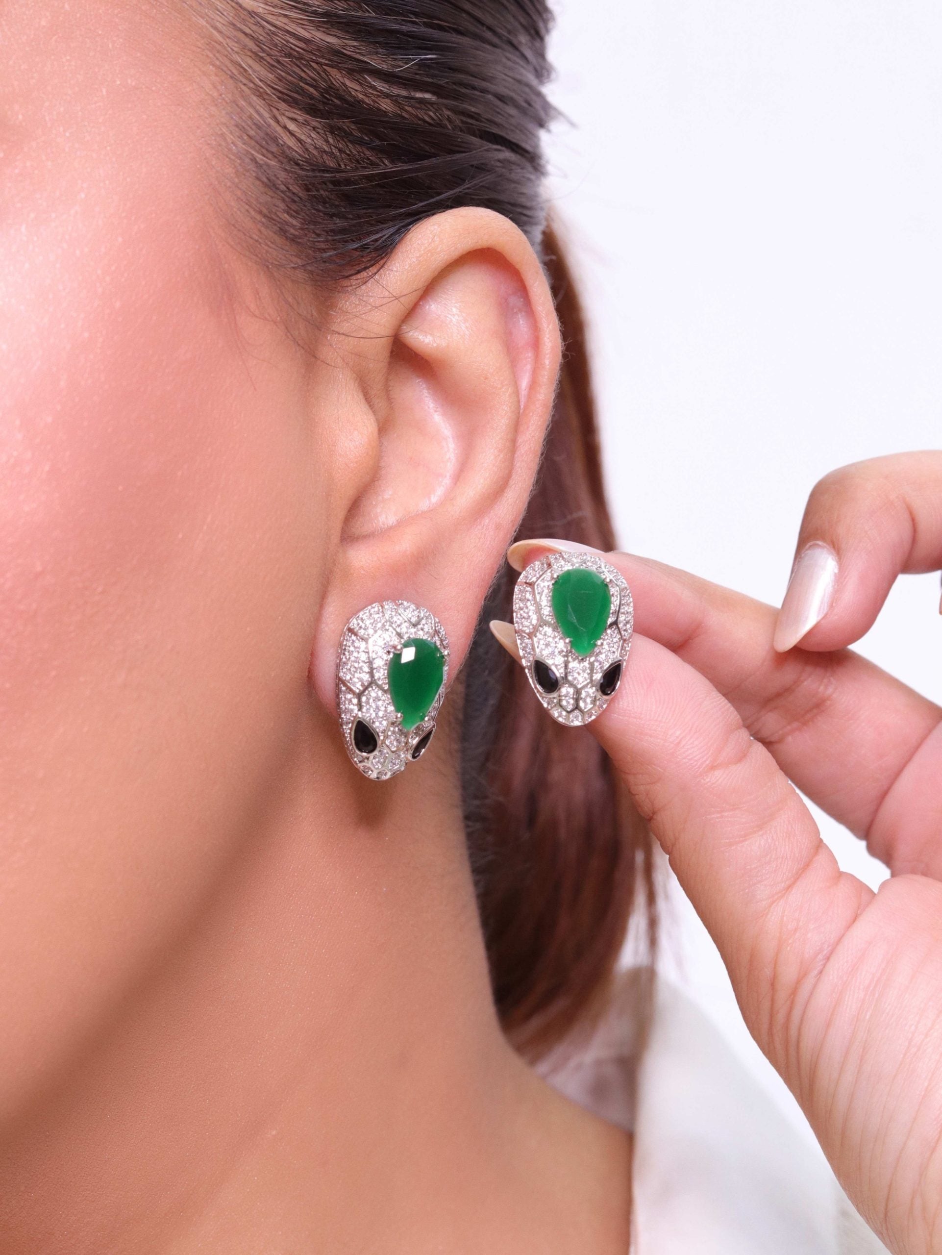 Emerald snake head studs
