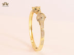 Panther heads gold and emerald bracelet