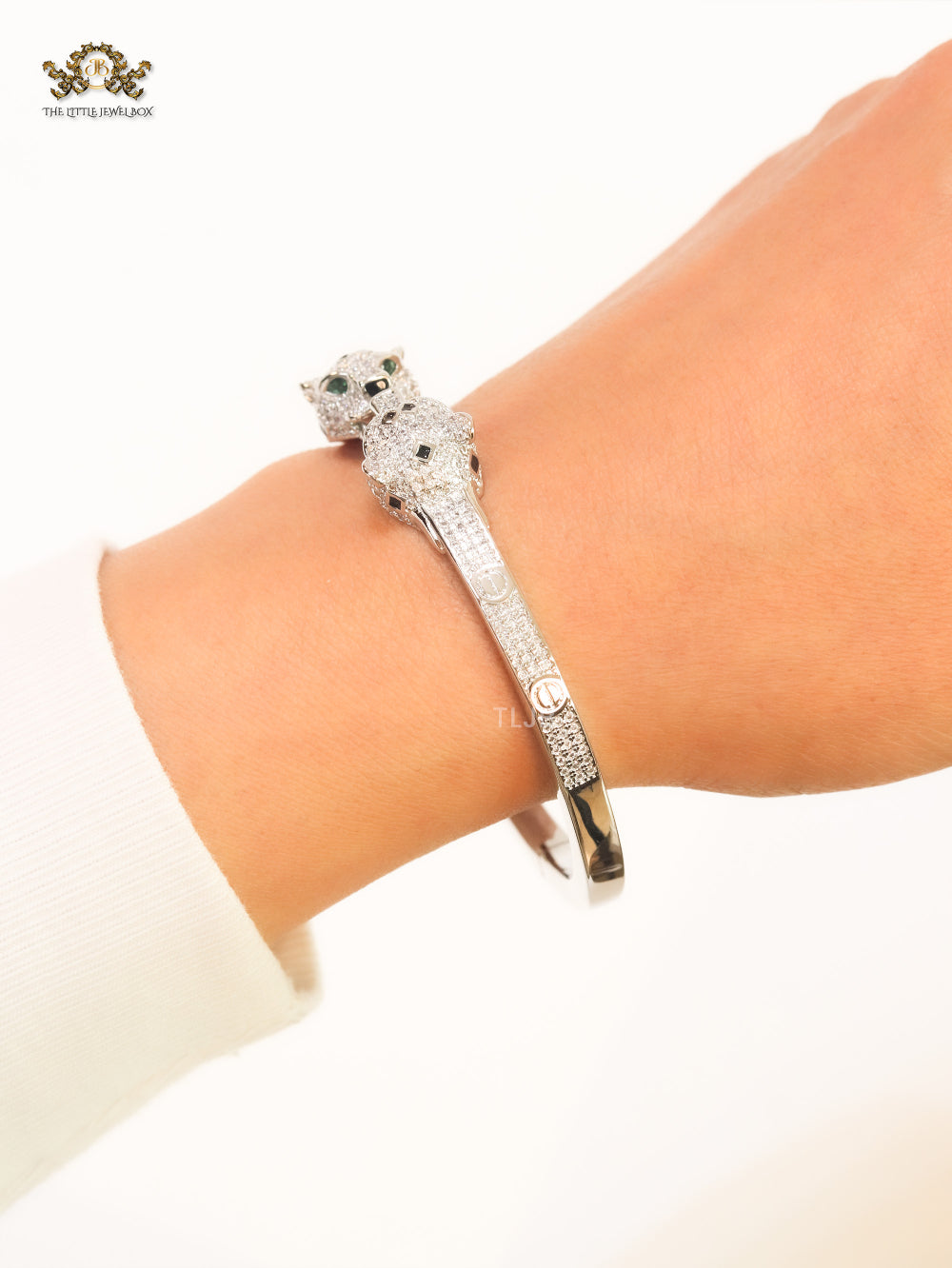 Panther heads platinum plated and emerald bracelet
