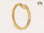 Gold serpentine and cz bracelet