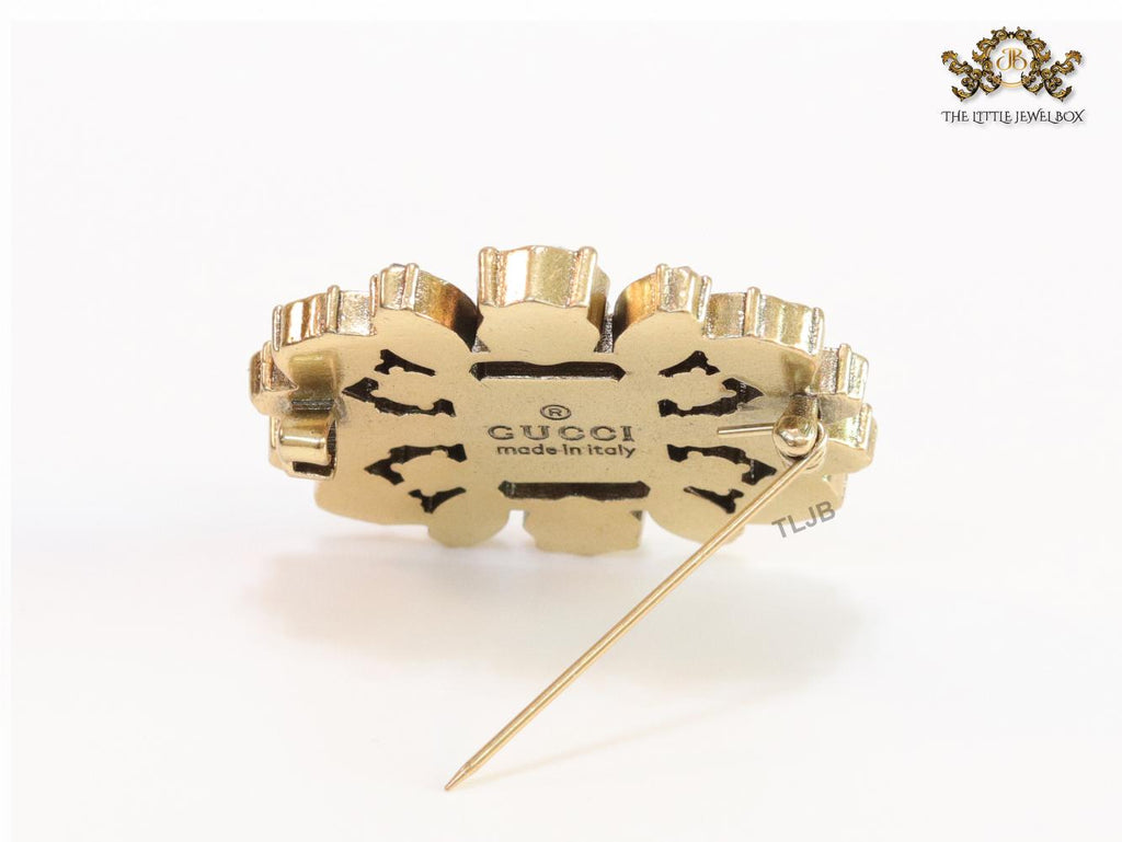 Emerald green stone and double G cz brooch