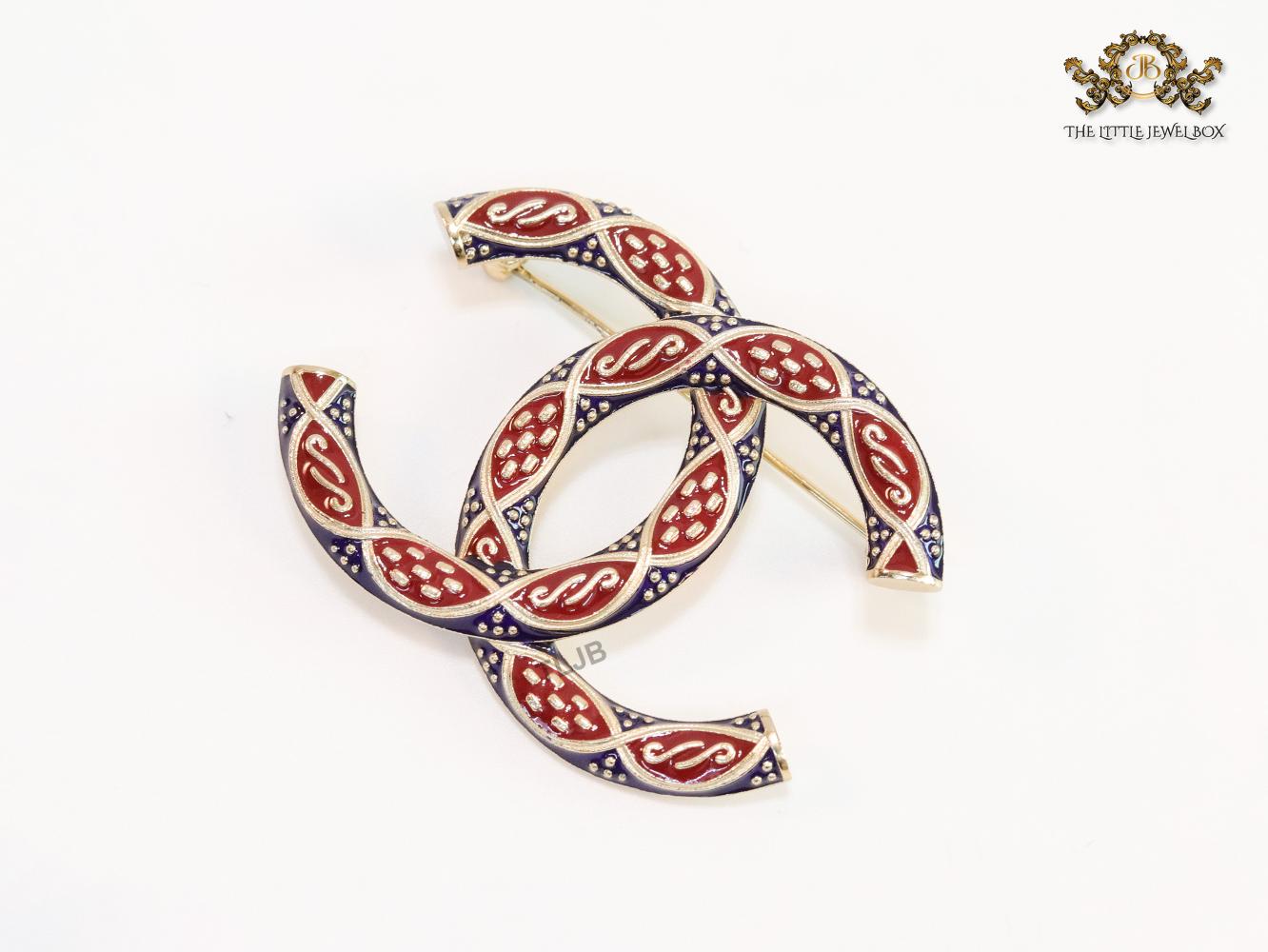 Double C red and blue embossed gold Brooch