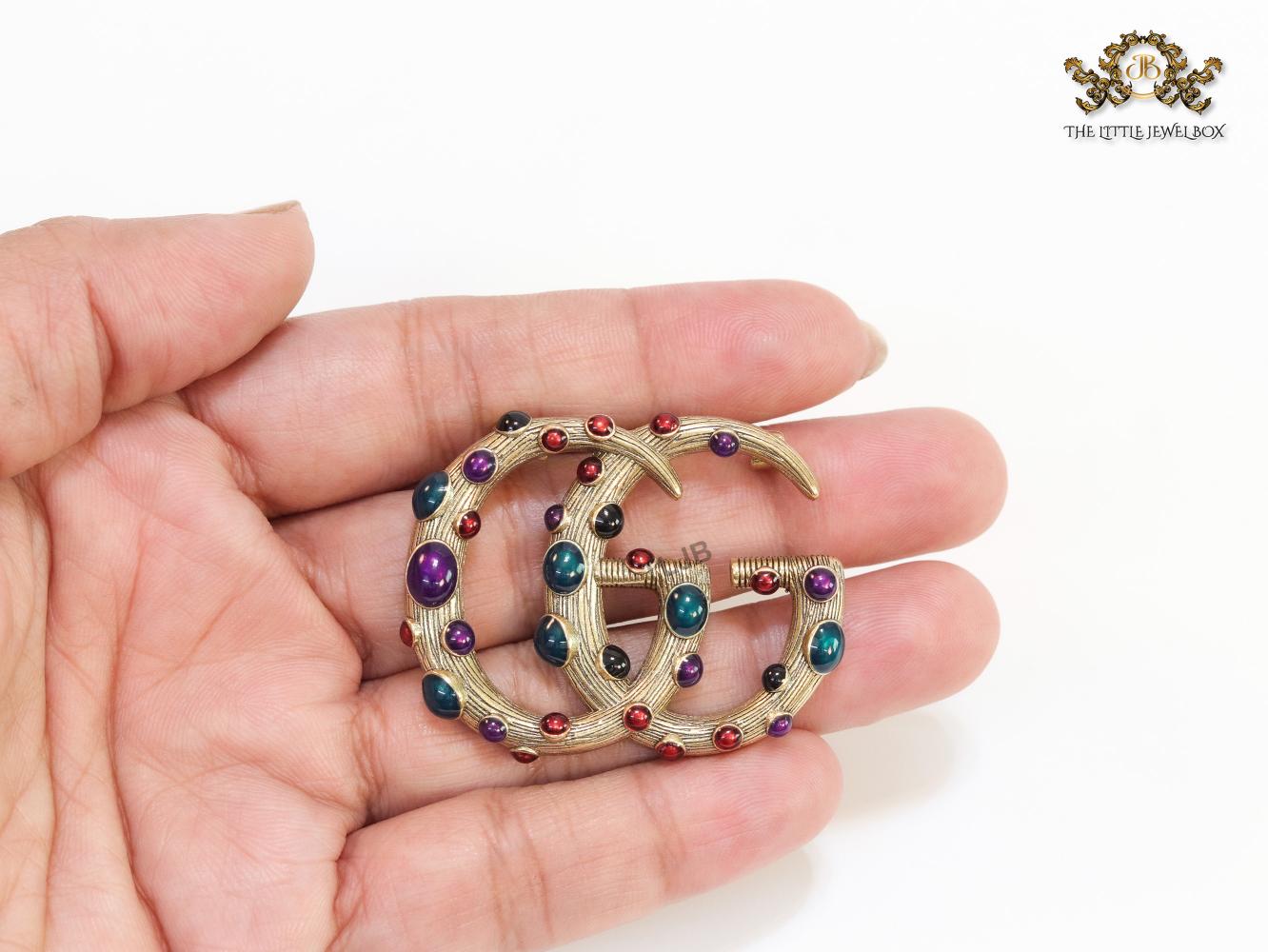 Rustic twin G brooch with multi coloured stones