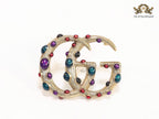Rustic twin G brooch with multi coloured stones