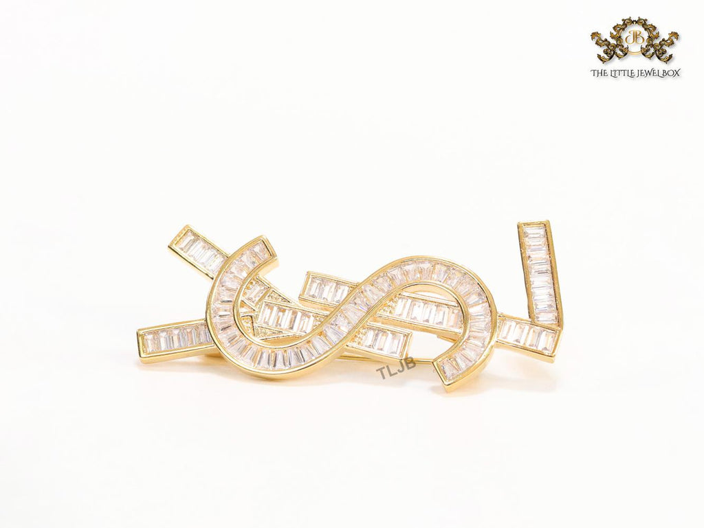 Golden alphabet brooch with cz baguettes