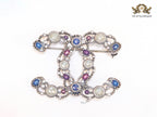 Antique platinum finish double C brooch with multi coloured stones