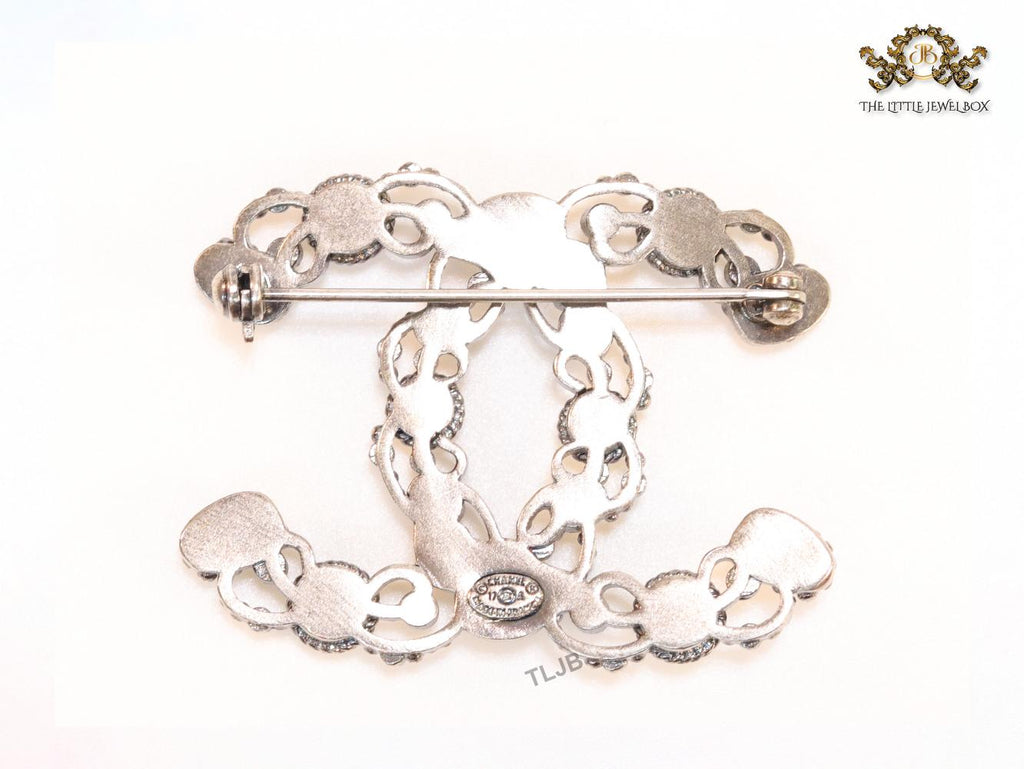 Antique platinum finish double C brooch with multi coloured stones