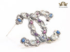 Antique platinum finish double C brooch with multi coloured stones