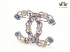 Antique platinum finish double C brooch with multi coloured stones