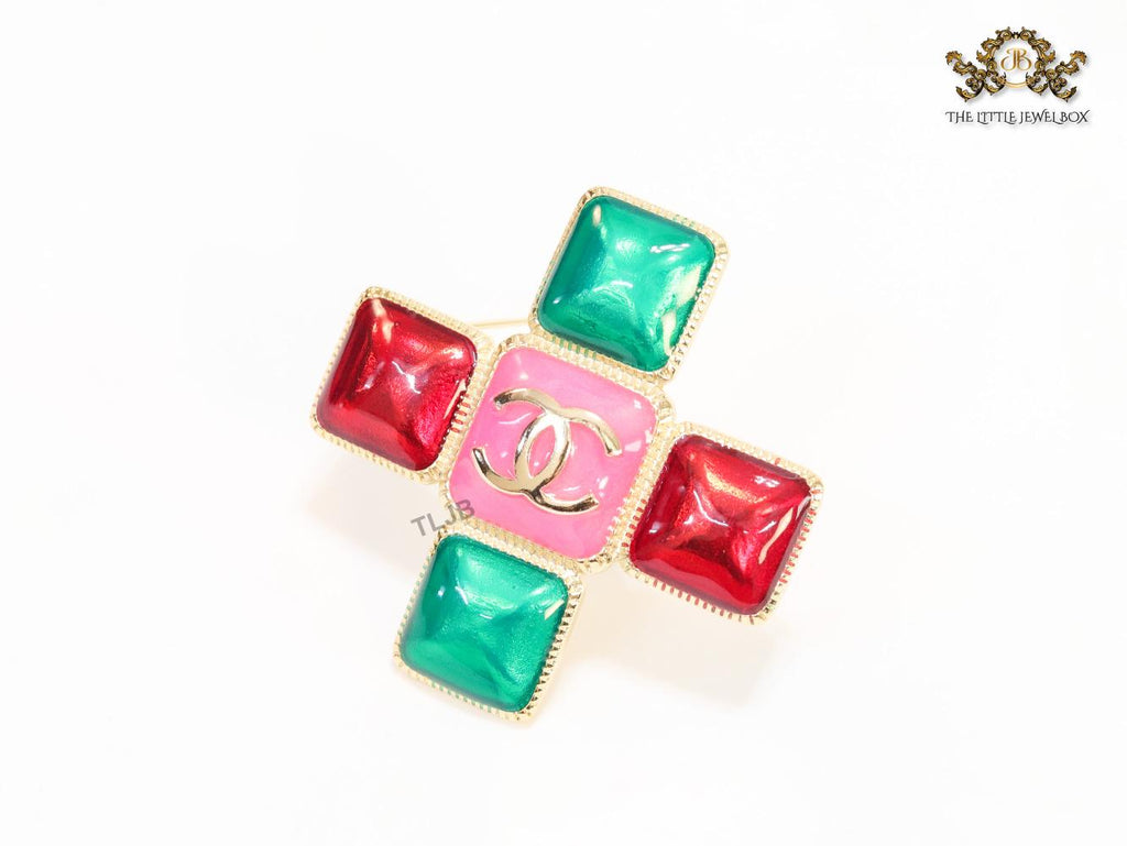 Multi Coloured enamel coated golden brooch with twin C motif