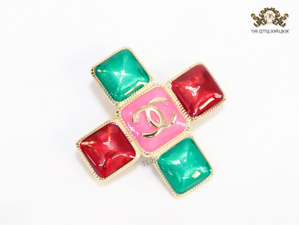 Multi Coloured enamel coated golden brooch with twin C motif